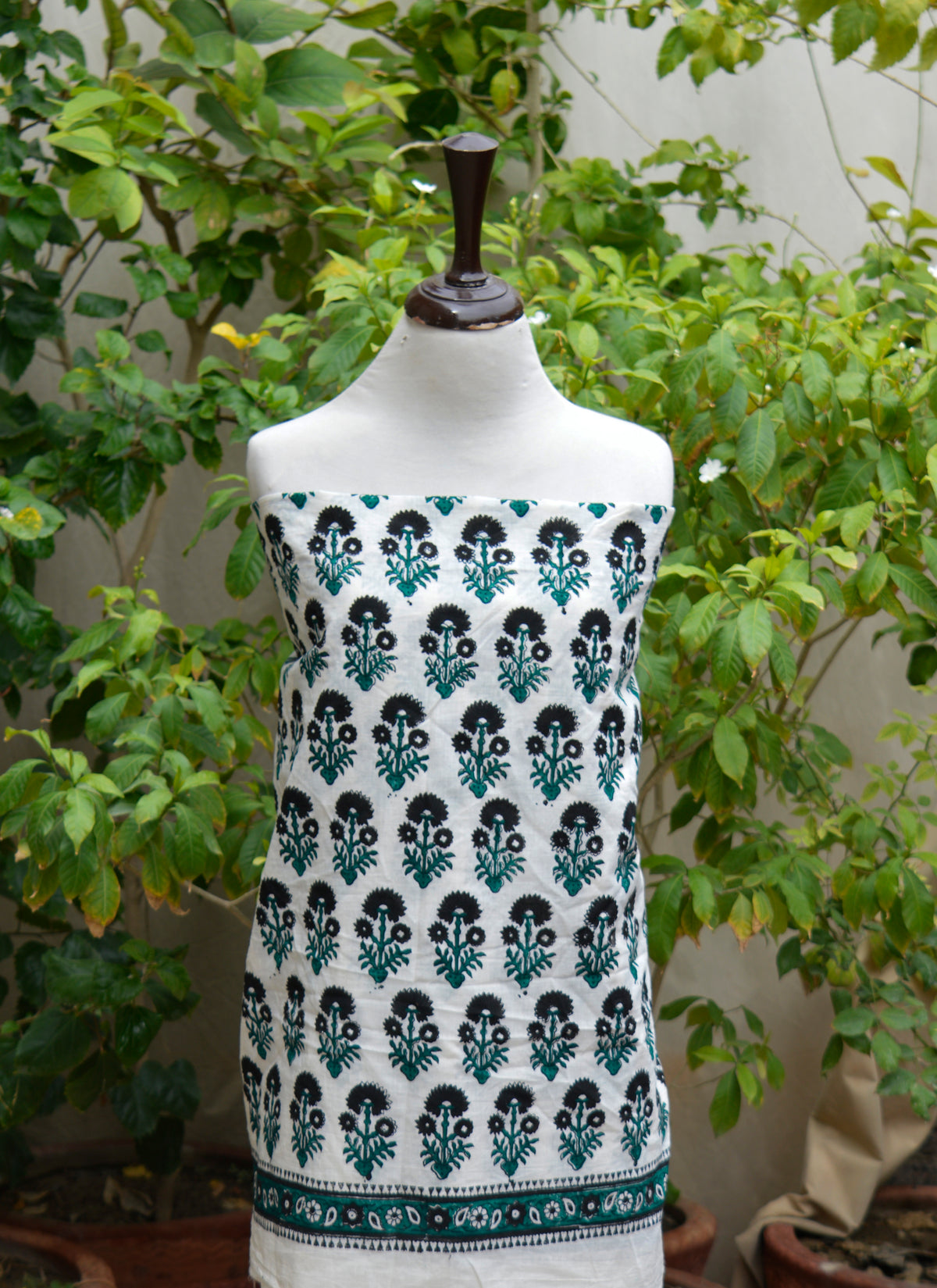 Unstitched cotton two-piece for women featuring artisan hand block printed floral butta design