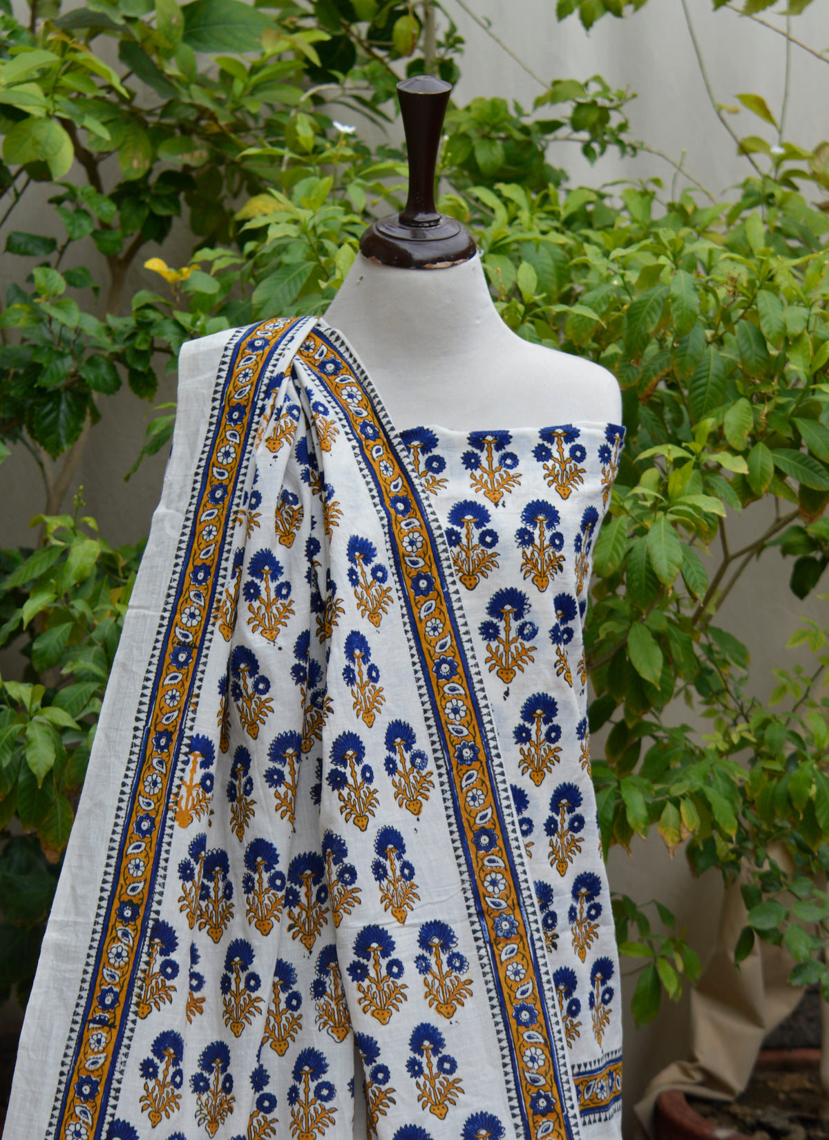 Unstitched cotton suit featuring blue floral block print and artisan handcrafted design