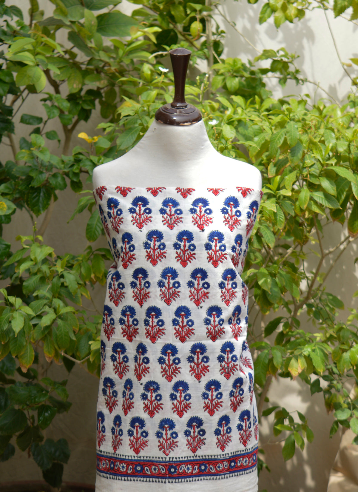 Handmade blue floral butta cotton dress material featuring artisan block printing