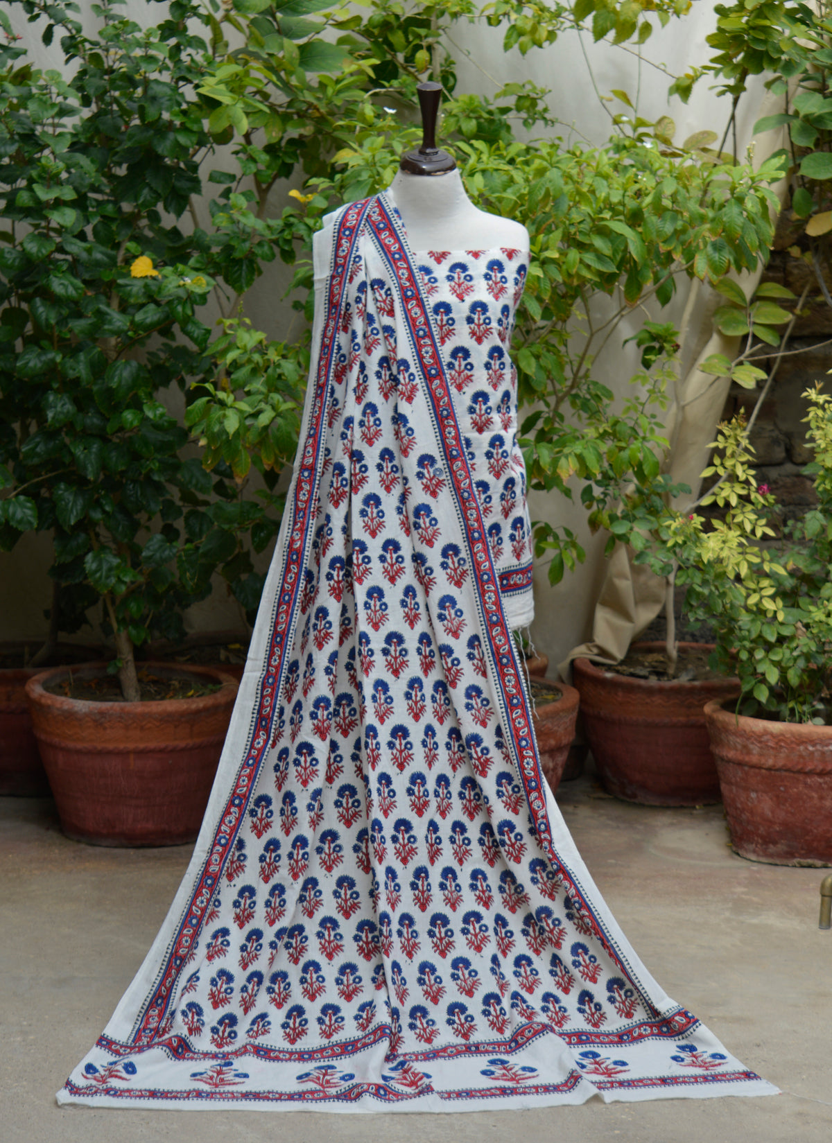 Unstitched cotton shirt and dupatta set with blue floral motifs and red stems
