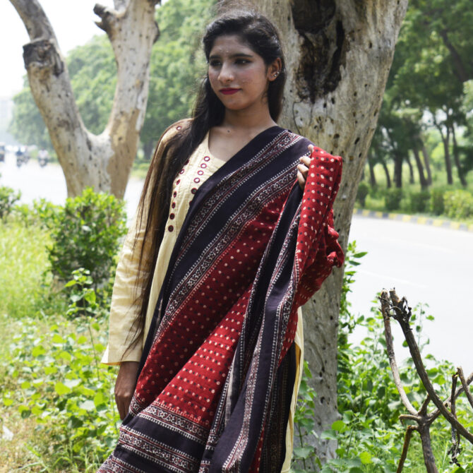 Stylish presentation of the Ajrak Odhni worn as a dupatta and shawl, highlighting its versatile styling options.