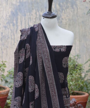 Ajrak Elephant, Close-up view of the hand block-printed shirt featuring intricate elephant motifs and geometric designs in deep black, showcasing traditional Ajrak craftsmanship.