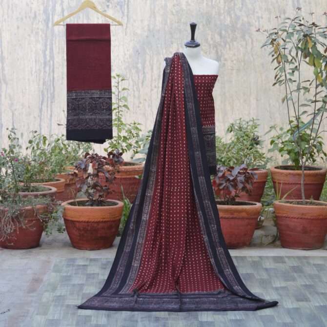 Organic Dye Hand Block Printed Ajrak Polka Dot Un-Stitched Three-Piece Set including shirt, trouser, and dupatta in deep black with intricate patterns.