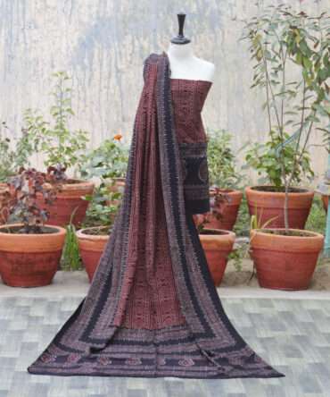 Ajrak Red Chunri,Elegant dupatta displayed draped over a model, adorned with detailed geometric and floral designs in organic dye, highlighting sustainable fashion.