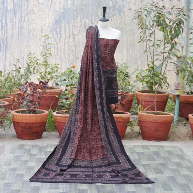 Ajrak Red Chunri,Elegant dupatta displayed draped over a model, adorned with detailed geometric and floral designs in organic dye, highlighting sustainable fashion.