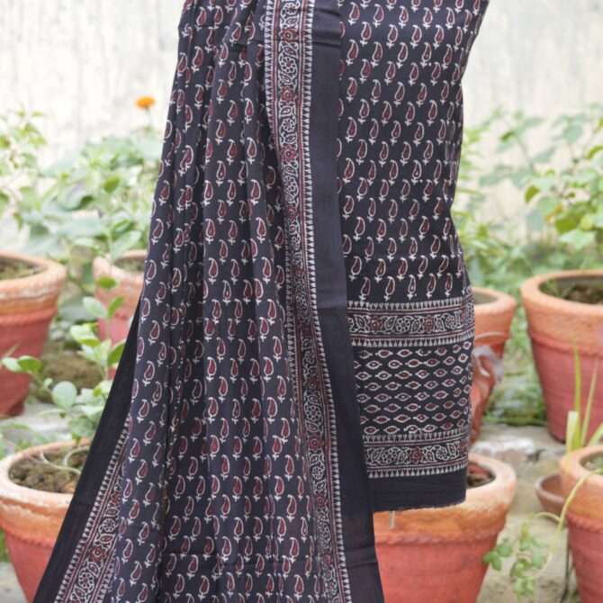 Detail shot of the dupatta edge and organic dye print in deep black, highlighting the craftsmanship of Ajrak printing.