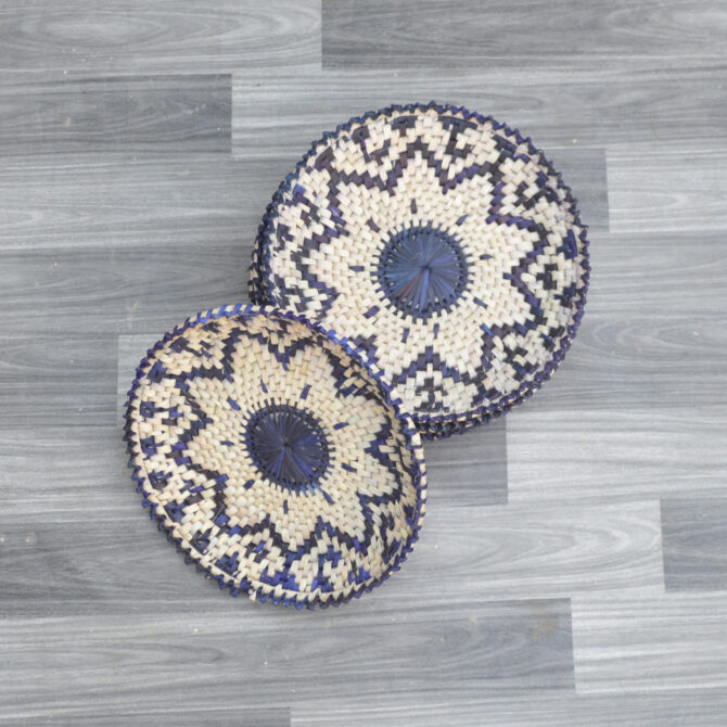 Close-up of intricate weaving on eco-friendly palm leaf bread plates, part of a 16-piece dining set.