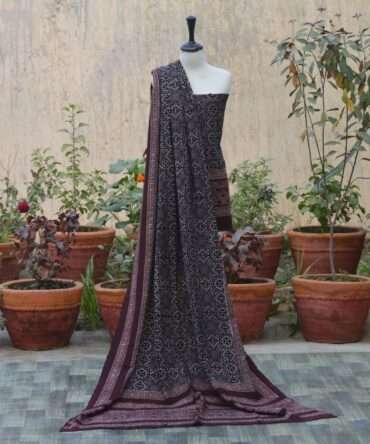 Ajrak Black Chunri, Elegant dupatta draped elegantly, adorned with detailed geometric and floral designs in organic dye, reflecting sustainable fashion practices.