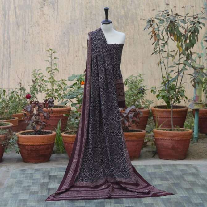 Ajrak Black Chunri, Elegant dupatta draped elegantly, adorned with detailed geometric and floral designs in organic dye, reflecting sustainable fashion practices.