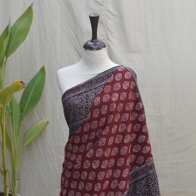 A Dummy gracefully draped in an Ajrak Saree Floral, exuding elegance with its timeless design and handcrafted artistry.