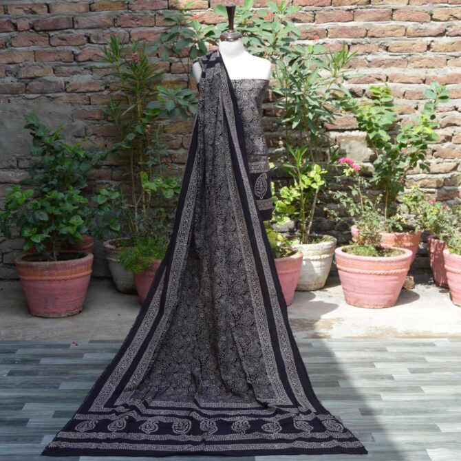 Ajrak Anbi Jaal Black Unstitched Two-Piece Set Display – A beautiful unstitched black shirt and dupatta set with geometric and floral motifs, hand block printed using traditional Ajrak techniques.