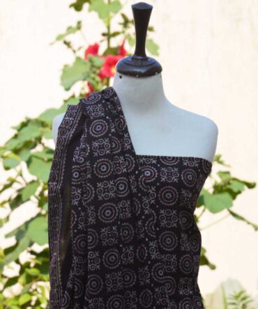 Close-up of Ajrak Black MJD shirt and dupatta with hand block printed designs in deep black, showcasing traditional craftsmanship.