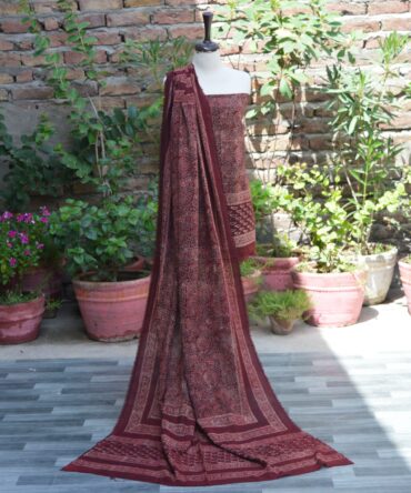 Organic Dye Hand Block Printed Ajrak Anbi Jaal Unstitched Two-Piece (Shirt and Dupatta) – A beautifully handcrafted unstitched shirt and dupatta set with intricate geometric and floral motifs in deep maroon on lawn cotton fabric.