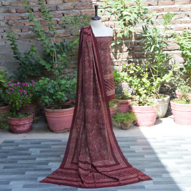 Organic Dye Hand Block Printed Ajrak Anbi Jaal Unstitched Two-Piece (Shirt and Dupatta) – A beautifully handcrafted unstitched shirt and dupatta set with intricate geometric and floral motifs in deep maroon on lawn cotton fabric.