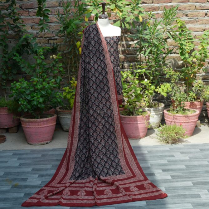 Organic Dye Hand Block Printed Ajrak Floral Butta Un-Stitched Two-Piece (Shirt and Dupatta): A traditional unstitched two-piece set with floral butta and geometric patterns in deep black and red, hand block printed using organic dyes.