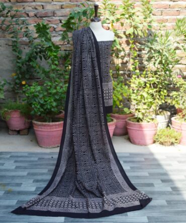 Ajrak Black Chunri Floral, Elegant dupatta draped elegantly, showcasing detailed geometric and floral designs in organic dye, emphasizing sustainable fashion.