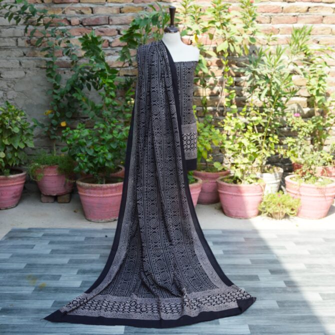 Ajrak Black Chunri Floral, Elegant dupatta draped elegantly, showcasing detailed geometric and floral designs in organic dye, emphasizing sustainable fashion.