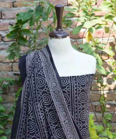 Ajrak Black Chunri Floral, Close-up of the un-stitched shirt featuring intricate hand block printed patterns in deep black, highlighting traditional Ajrak craftsmanship.