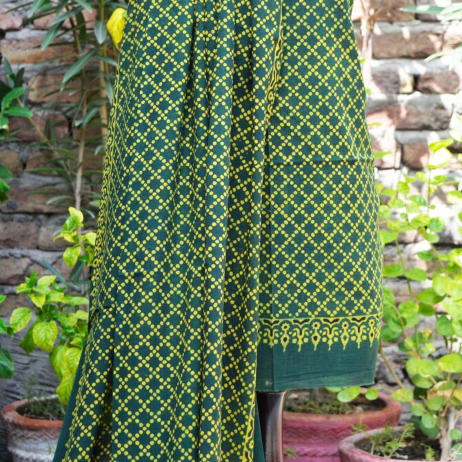 Ajrak Green Dupatta Styling: A versatile green dupatta from the Ajrak two-piece set, styled over the shoulder, highlighting the rich traditional motifs and soft cotton texture.