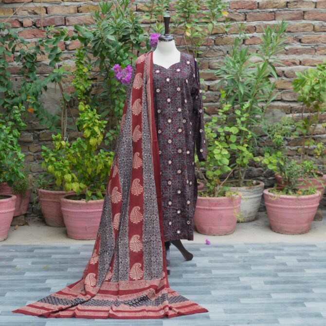 A finely printed black Ajrak kurta with intricate geometric patterns and rich maroon accents, adorned with mirror embroidery on high-quality lawn cotton fabric.