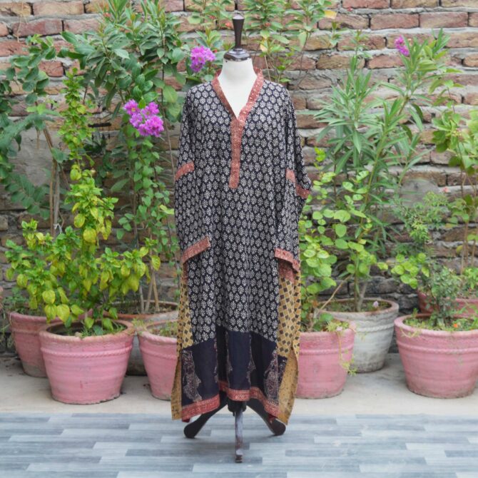 Ajrak Kurta Free Size Displayed on Mannequin: "Organic Dye Hand Block Printed Ajrak Free Size Kurta displayed on a mannequin, showcasing intricate geometric and floral patterns in deep black. The kurta is made of breathable Lawn cotton