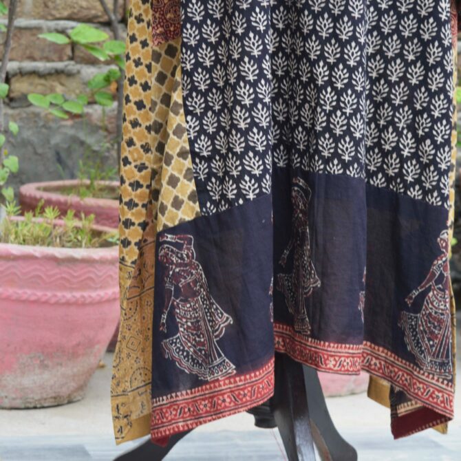 A close-up shot of the Lawn cotton fabric of the Ajrak Kurta, showing Dancing Girl Motif emphasizing the soft, breathable texture and natural weave.