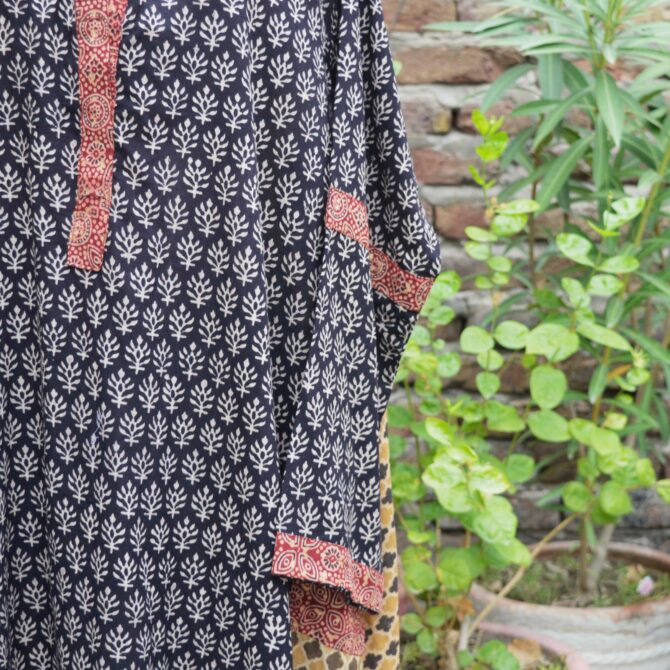 A close-up shot of the Lawn cotton fabric of the Ajrak Kurta, emphasizing the soft, breathable texture and natural weave.