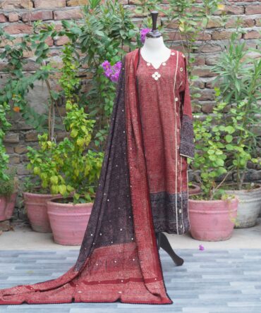 Ajrak Kurti Set featuring hand block-printed deep red and black geometric and floral patterns, paired with a Dupatta adorned with shimmering sitara and piko finishing