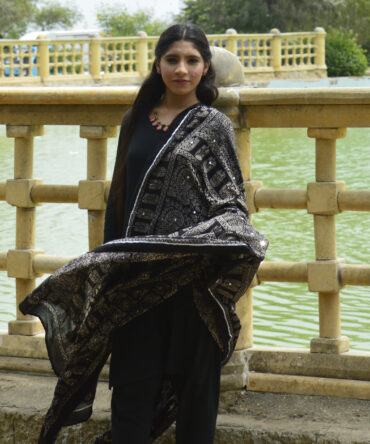 Ajrak Shawl ,Elegant Organic Dye Hand Block Printed Black Ajrak Odhni featuring intricate geometric patterns and shimmering sitara sequences.