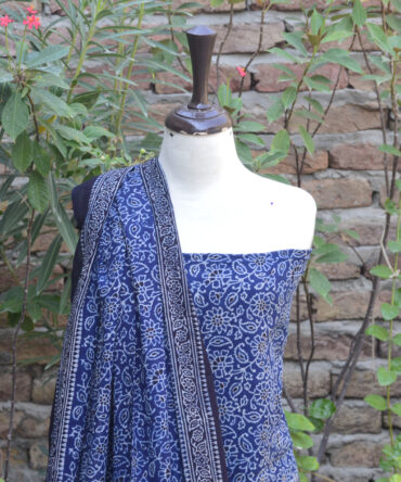 Ajrak Lawn Fabric, Eco-Conscious Clothing, eco-friendly fashion, Hand Block Printed Fabric, Handcrafted Ajrak Designs, Indigo Ajrak Floral Suit, Organic Ajrak Suit, Premium Quality Two-Piece Suit, Sustainable Dyeing Process, Traditional Ajrak Print, Ajrak Indigo, Ajrak Blue