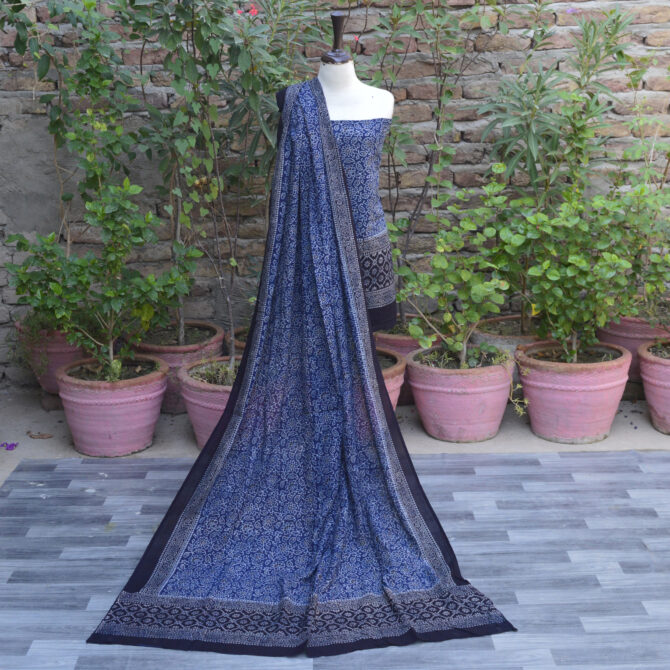 Ajrak Dress, Ajrak Block Print, Ajrak Lawn Fabric, Eco-Conscious Clothing, eco-friendly fashion, Hand Block Printed Fabric, Handcrafted Ajrak Designs, Indigo Ajrak Floral Suit, Organic Ajrak Suit, Premium Quality Two-Piece Suit, Sustainable Dyeing Process, Traditional Ajrak Print, Ajrak Indigo, Ajrak Blue