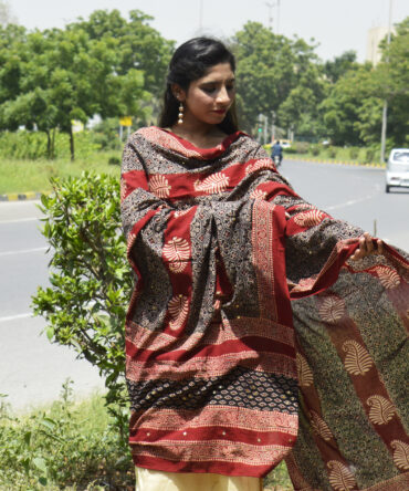 Close-up of shimmering sitara sequences and delicate thread tassels on the Organic Dye Hand Block Printed Ajrak Odhni.