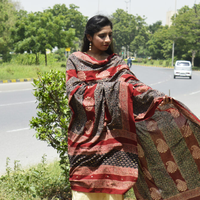 Close-up of shimmering sitara sequences and delicate thread tassels on the Organic Dye Hand Block Printed Ajrak Odhni.