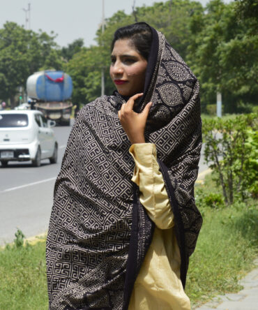 "Close-up view of the luxurious lawn cotton fabric of the Organic Dye Hand Block Printed Ajrak Odhni, highlighting the fine details and organic dye patterns.