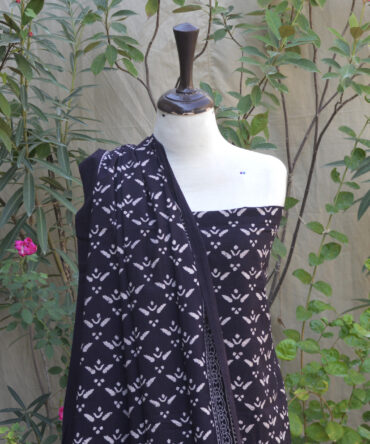 Ajrak Pankhri Dress,Close-up view of the hand block printed Ajrak Pankhrri design, showcasing detailed black geometric and floral patterns on soft Lawn cotton fabric.