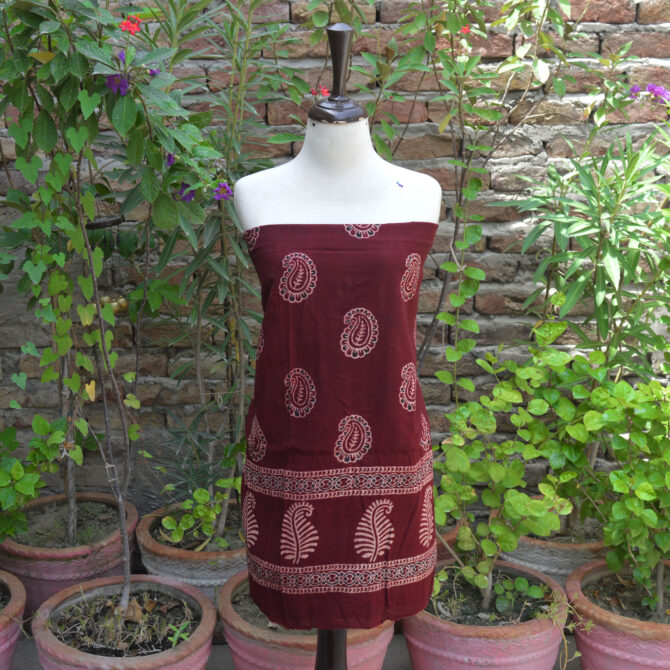 Ajrak Red Anbi Organic Dye Hand Block Printed unstitched two-piece dress featuring a deep red shirt and dupatta with intricate geometric and floral motifs, showcasing traditional craftsmanship.