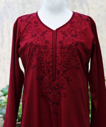 our stunning Blossom Hand Embroidered Maroon Two-Piece Set. This exquisite outfit features a delicately embroidered shirt with intricate Tarkashi and Tukri Applic designs, paired seamlessly with comfortable trousers.