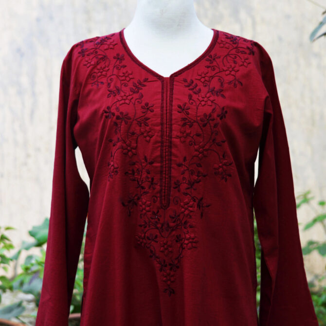 our stunning Blossom Hand Embroidered Maroon Two-Piece Set. This exquisite outfit features a delicately embroidered shirt with intricate Tarkashi and Tukri Applic designs, paired seamlessly with comfortable trousers.