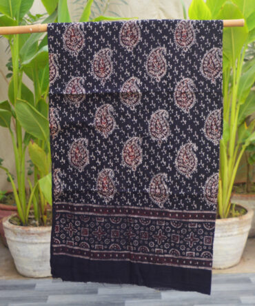 Organic Dye Hand Block Printed Ajrak Anbi Shirt (Un-Stitched), showcasing intricate black and red geometric and Anbi patterns on luxurious Lawn cotton fabric, beautifully handcrafted by artisans.