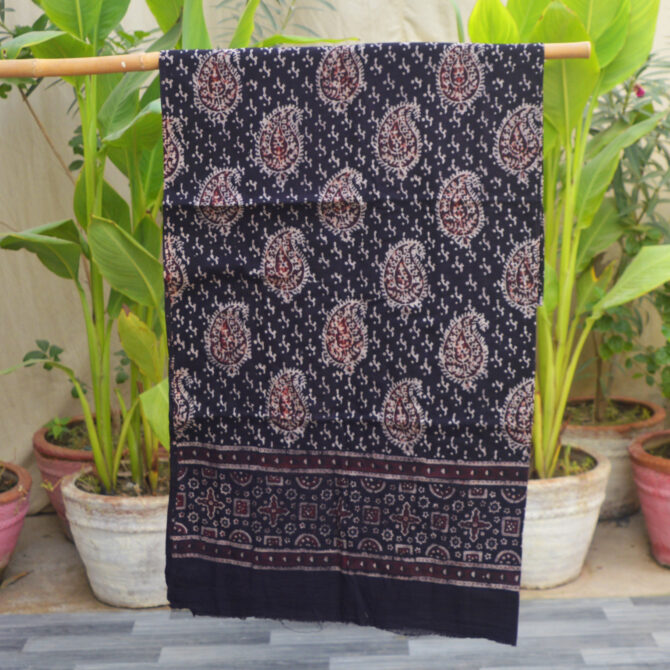 Organic Dye Hand Block Printed Ajrak Anbi Shirt (Un-Stitched), showcasing intricate black and red geometric and Anbi patterns on luxurious Lawn cotton fabric, beautifully handcrafted by artisans.