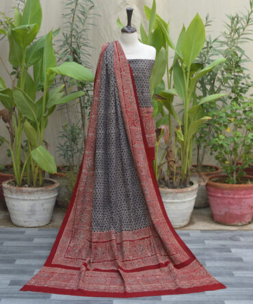 Ajrak Patti Floral, Ajrak dress set featuring unstitched shirt and dupatta, showcasing artisan-crafted block prints and sustainable organic dyes in a deep black and red palette.