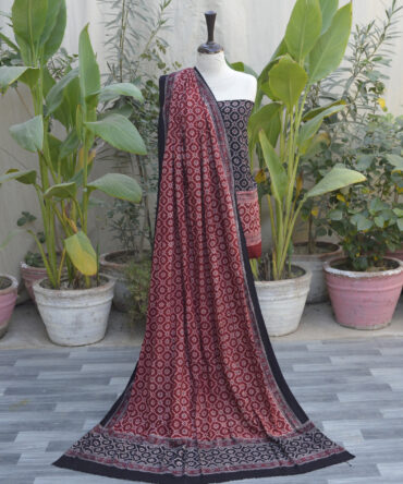 Two-piece unstitched Ajrak Floral Jaal Contrast dress set, including a shirt and generously sized dupatta, styled elegantly to showcase its versatility.